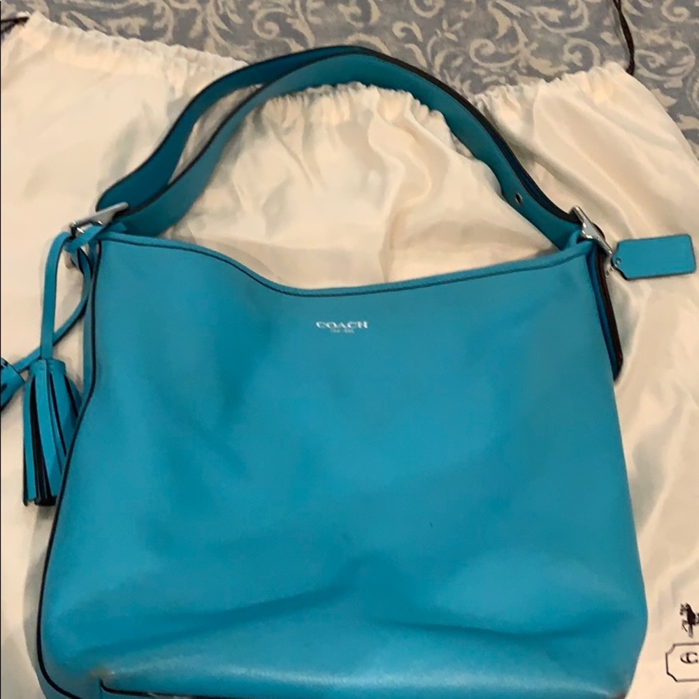 Coach Bucket Bag with matching wallet.